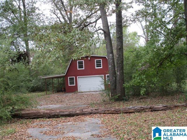 garage featuring driveway and a garage