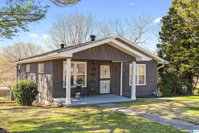 view of front of home featuring a front lawn and a porch