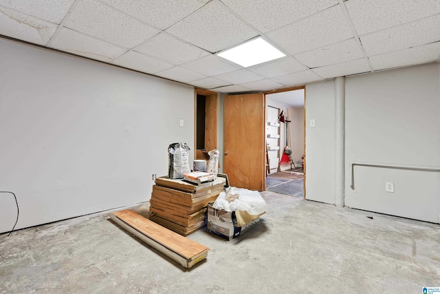 basement featuring a drop ceiling