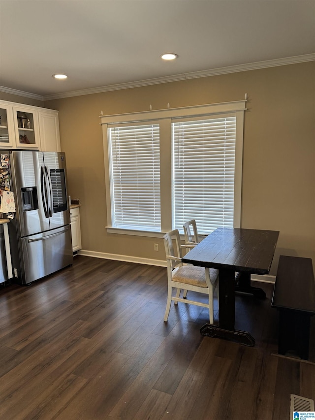 dining area with dark wood-style floors, recessed lighting, visible vents, ornamental molding, and baseboards