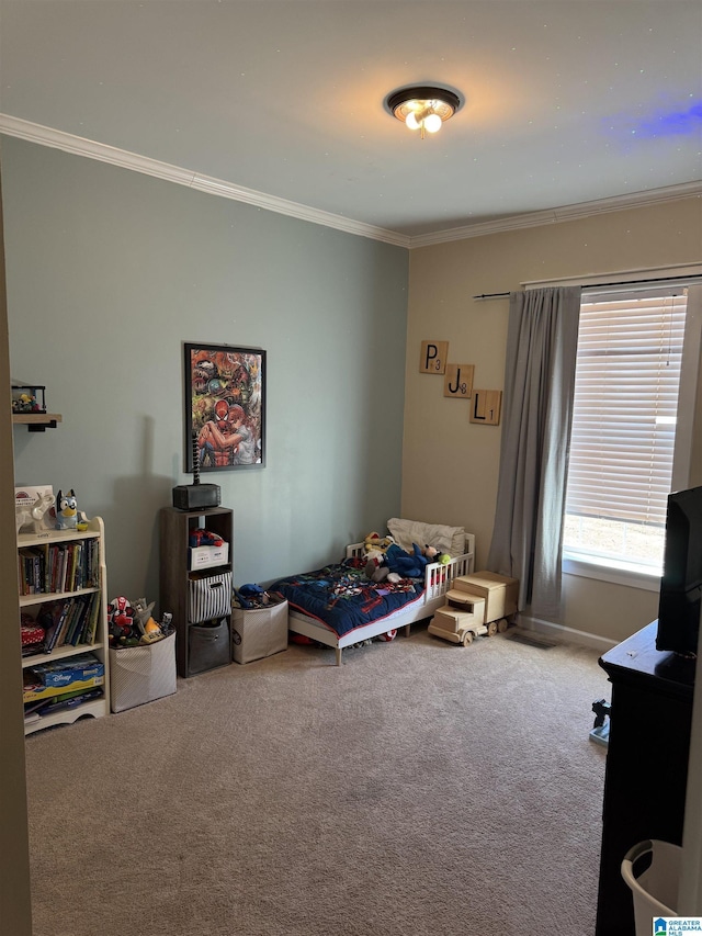 bedroom featuring ornamental molding and carpet floors