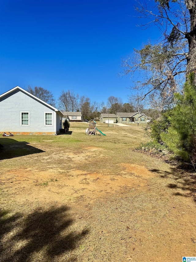 view of yard featuring a playground