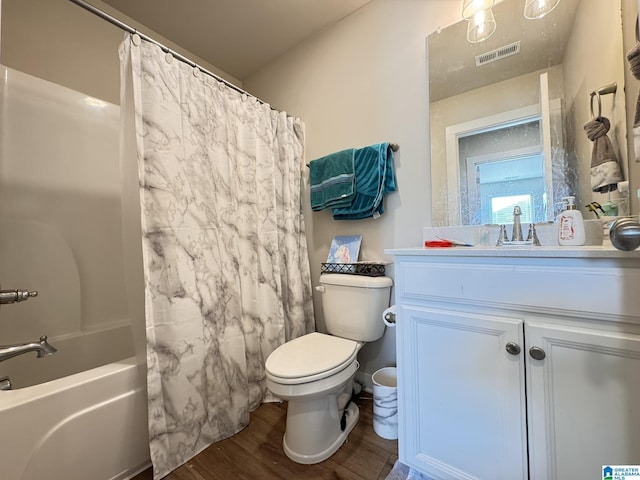 full bath featuring toilet, wood finished floors, vanity, visible vents, and shower / bath combination with curtain