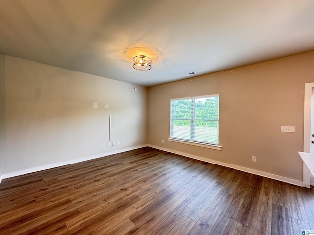 212 Buckhorn Cir, Weaver, AL 36277 - spare room with dark wood-type flooring and baseboards