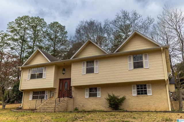 split foyer home with brick siding