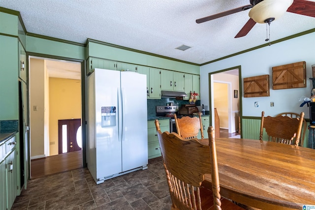kitchen featuring white refrigerator with ice dispenser, visible vents, green cabinets, stainless steel electric stove, and crown molding
