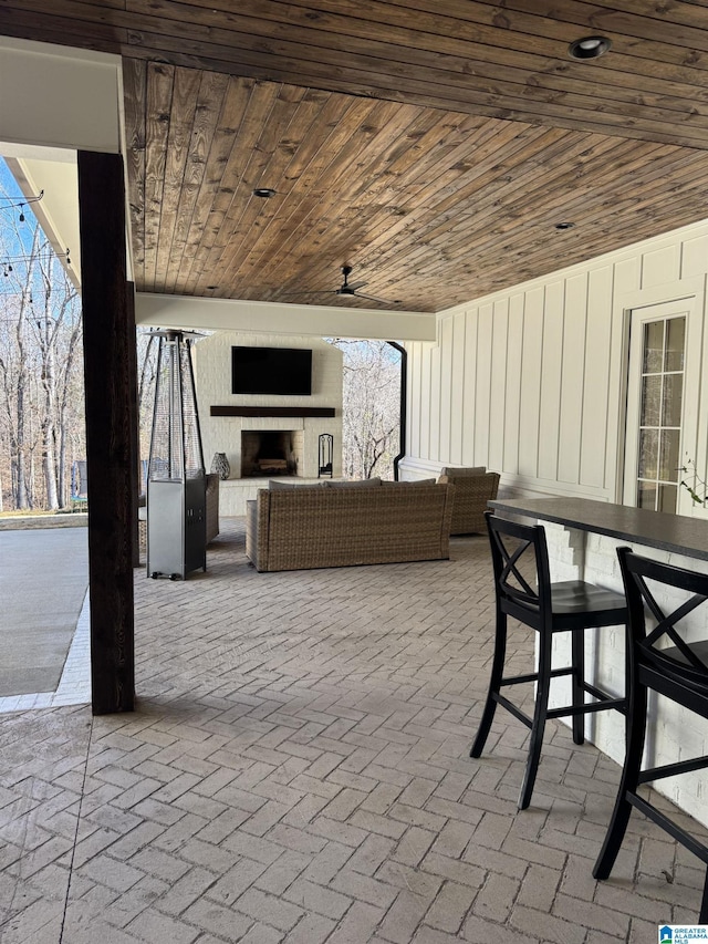 view of patio / terrace with outdoor dry bar and an outdoor hangout area