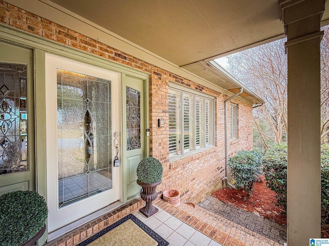 entrance to property with brick siding