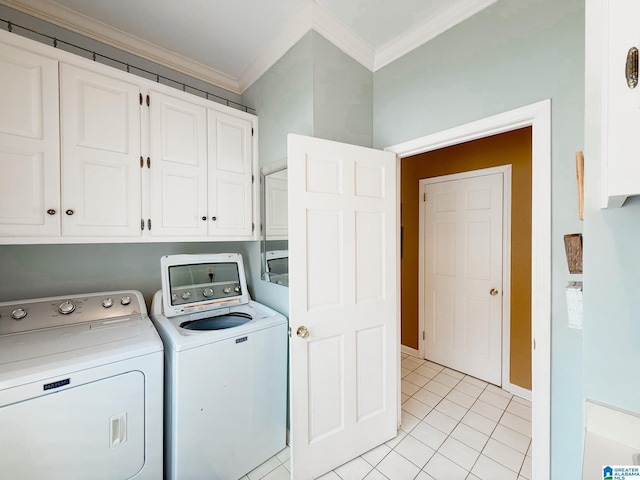 washroom with cabinet space, ornamental molding, separate washer and dryer, and light tile patterned flooring