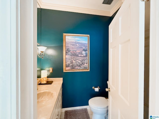 half bath featuring ornamental molding, baseboards, vanity, and toilet