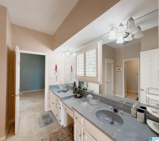 bathroom with double vanity and a sink