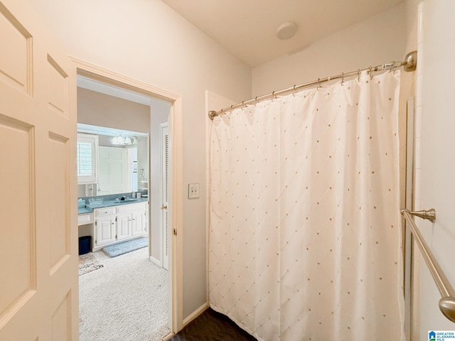 full bath featuring a shower with curtain and vanity