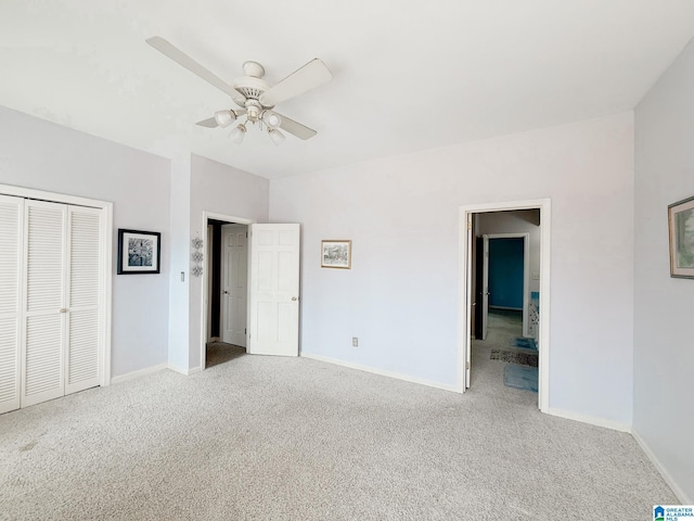 unfurnished bedroom featuring carpet flooring and baseboards