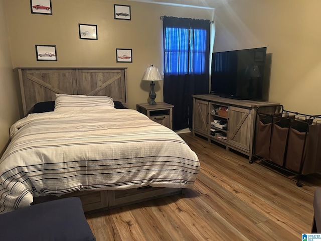 bedroom featuring wood finished floors