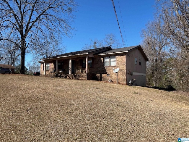 back of house with brick siding and crawl space