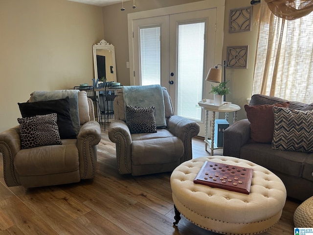 living room with french doors and wood finished floors