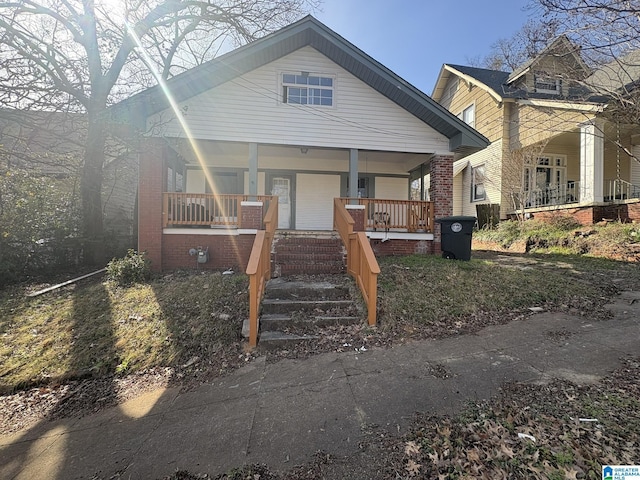 1322 17th St S, Birmingham, AL 35205 - bungalow-style home featuring covered porch and brick siding