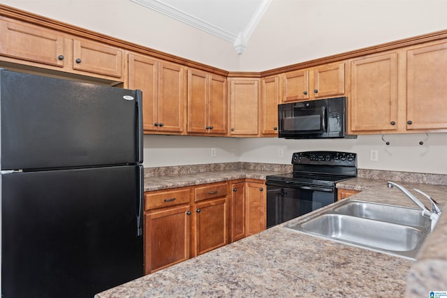 kitchen with a sink, black appliances, crown molding, and light countertops