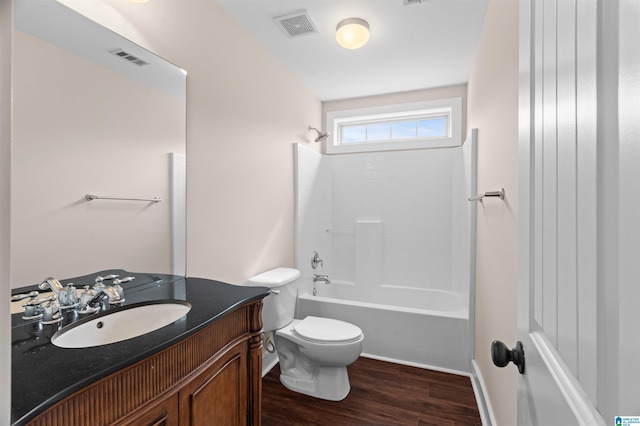 full bath featuring visible vents, toilet, wood finished floors, and vanity