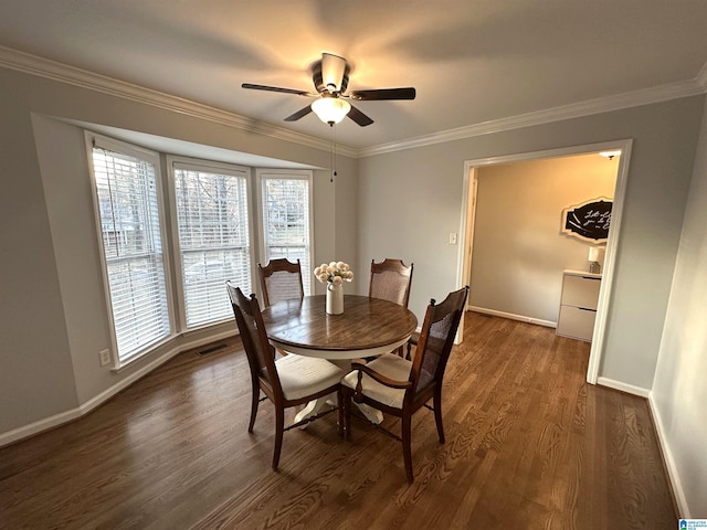 13733 Ginger Dr, Mccalla, AL 35111 - dining room featuring ornamental molding, baseboards, ceiling fan, and dark wood finished floors
