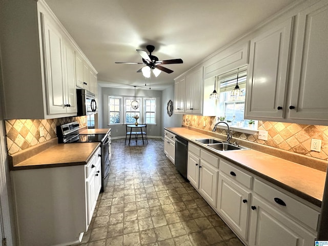 13733 Ginger Dr, Mccalla, AL 35111 - kitchen with white cabinetry, stainless steel microwave, baseboards, a sink, and electric range oven