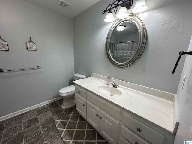 13733 Ginger Dr, Mccalla, AL 35111 - full bath featuring baseboards, visible vents, toilet, and vanity