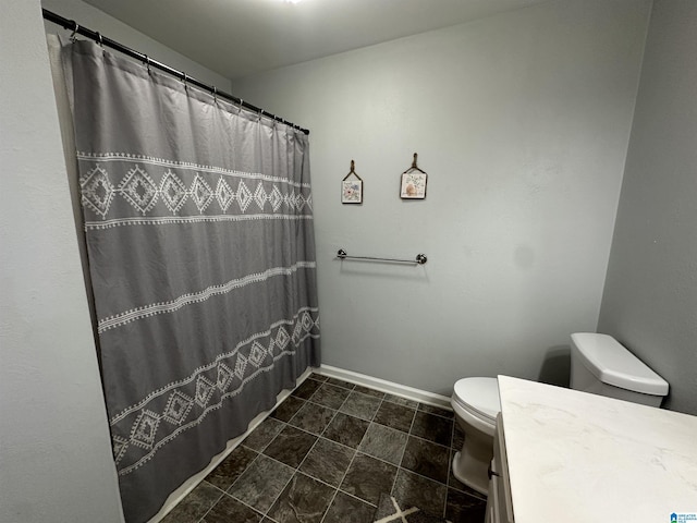 13733 Ginger Dr, Mccalla, AL 35111 - full bath featuring a shower with curtain, baseboards, toilet, and vanity