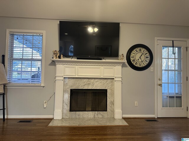 13733 Ginger Dr, Mccalla, AL 35111 - unfurnished living room featuring dark wood-style floors, baseboards, and visible vents