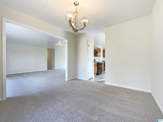 empty room featuring light carpet, baseboards, and a notable chandelier