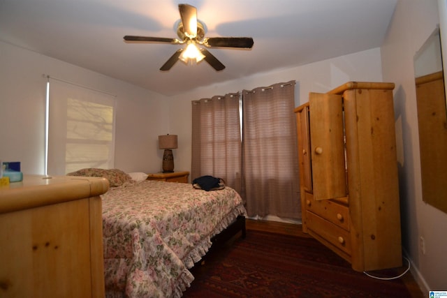 bedroom featuring a ceiling fan and wood finished floors