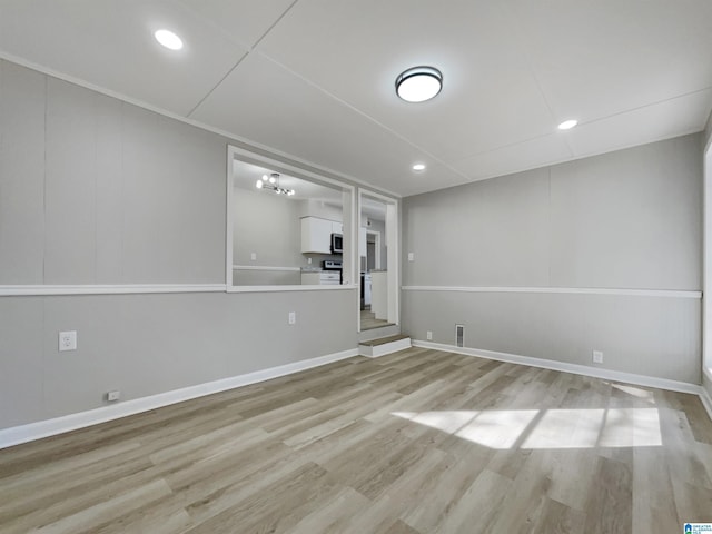 interior space featuring recessed lighting, light wood-style flooring, and baseboards