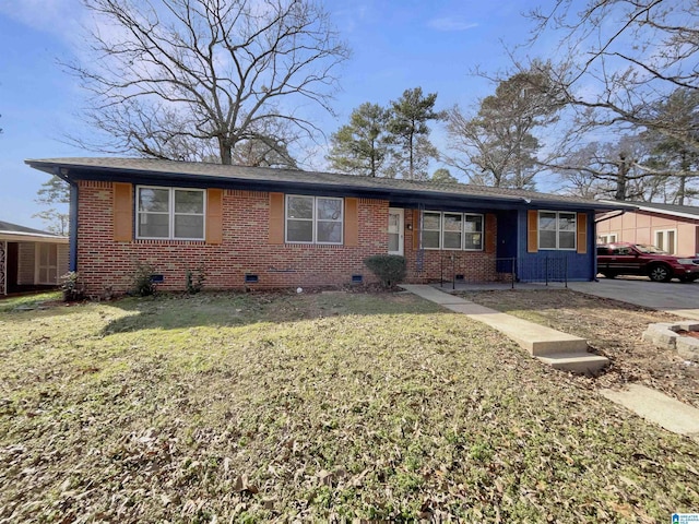 ranch-style home featuring brick siding, crawl space, and a front yard