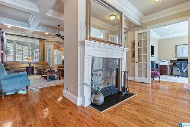 living room featuring ornamental molding, french doors, wood finished floors, and beam ceiling