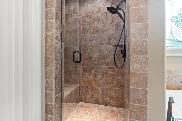 full bath with a shower stall