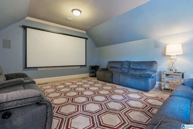 cinema featuring lofted ceiling, carpet, and baseboards