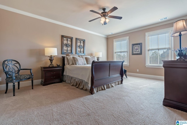 bedroom with baseboards, visible vents, ornamental molding, and light colored carpet