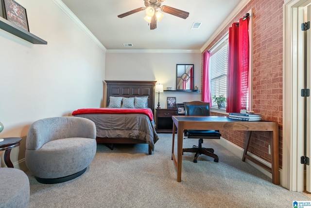 carpeted bedroom with visible vents, crown molding, baseboards, and ceiling fan