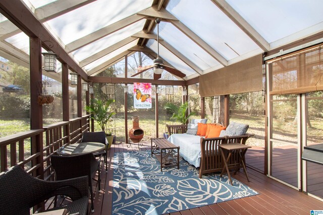 sunroom / solarium with lofted ceiling with beams and ceiling fan