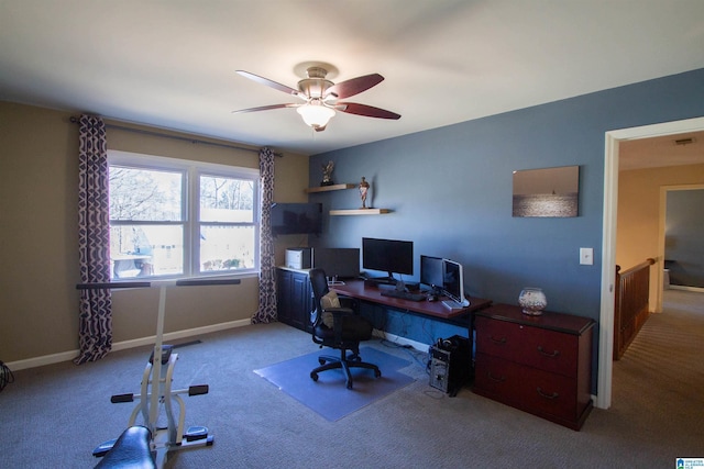 office space with carpet, visible vents, ceiling fan, and baseboards