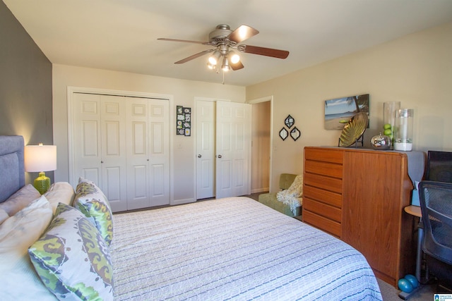 bedroom featuring two closets and a ceiling fan