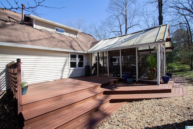 wooden terrace featuring a sunroom