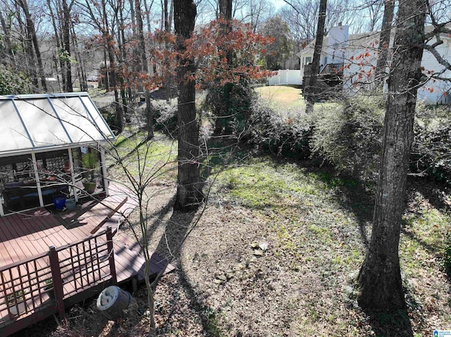 view of yard with an outbuilding and a greenhouse