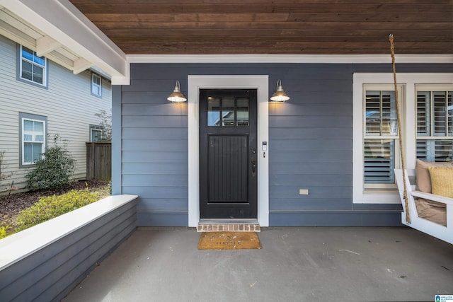 doorway to property featuring a porch