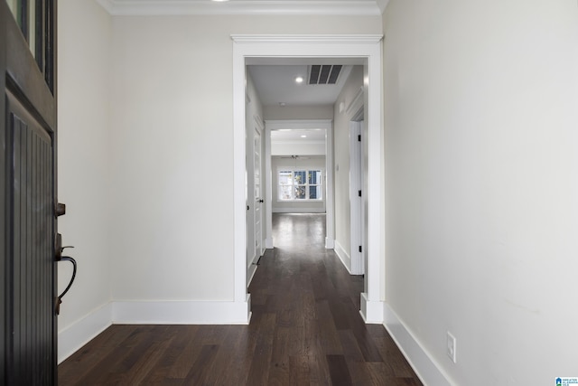 hall with baseboards, visible vents, dark wood-type flooring, and recessed lighting