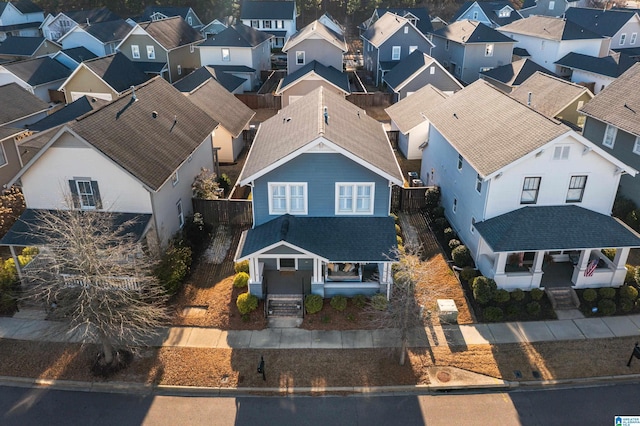 birds eye view of property with a residential view