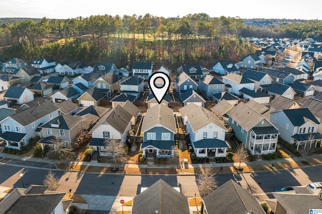 birds eye view of property with a residential view