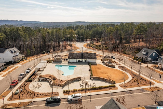 bird's eye view featuring a forest view