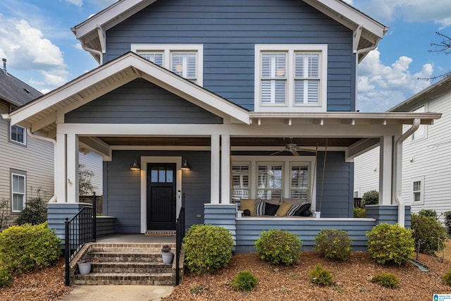 view of front of property with a porch and a ceiling fan