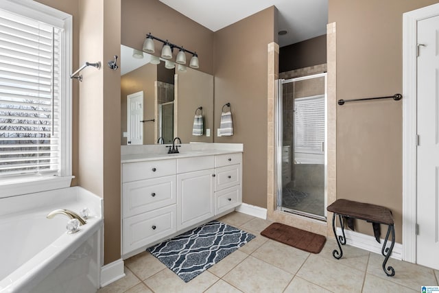 bathroom featuring a garden tub, a shower stall, and tile patterned flooring