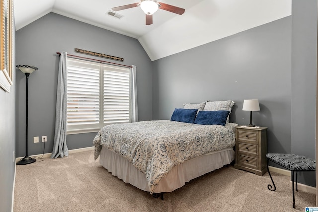 bedroom with lofted ceiling, baseboards, visible vents, and light colored carpet